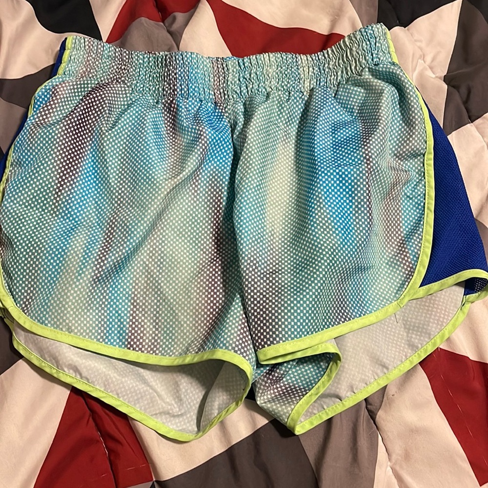 Used to good condition size 10 in kids running shorts in multi color